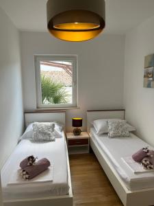 Ένα ή περισσότερα κρεβάτια σε δωμάτιο στο Luxury Apartment Julie +20 φωτογραφίες