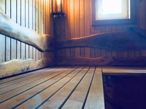 an empty room with a bed and a window at PINCIKAJAS Holiday Home in Malveši