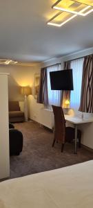 Postel nebo postele na pokoji v ubytování Hotel Garni "Am Ellinger Tor"