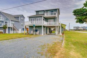 a large house with a driveway in front of it at Topsail Beach Vacation Rental Steps to Shore! in Topsail Beach