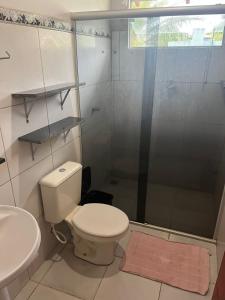 a bathroom with a toilet and a shower and a sink at CASA de bonito in Bonito