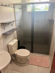 a bathroom with a shower and a toilet and a sink at CASA de bonito in Bonito