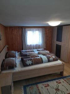 Postel nebo postele na pokoji v ubytování Oberhöher Apt Talblick