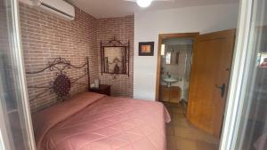 Postel nebo postele na pokoji v ubytování Casa Rural Los Pepe Sancti Petri