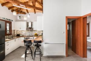Kuchyň nebo kuchyňský kout v ubytování Eloise Apartments + 8 fotografií