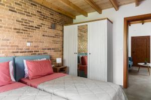 Postel nebo postele na pokoji v ubytování Eloise Apartments
