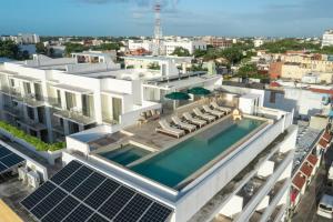 an aerial view of a building with a swimming pool at Antera Hotel & Residences in Playa del Carmen