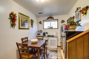 a dining room with a table and a kitchen at Spokane Valley Vacation Rental with Shared Pool! in Spokane Valley