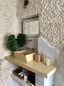 a bathroom counter with a sink and a window at Arya's Nest in Mijas