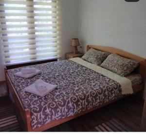 Postel nebo postele na pokoji v ubytování Apartman NIKOLIJA 2