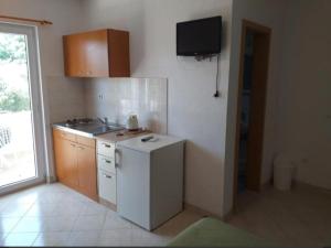 Kuchyň nebo kuchyňský kout v ubytování Studio apartmani Ante