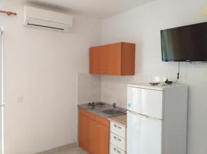 Kuchyň nebo kuchyňský kout v ubytování Studio apartmani Ante