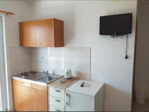 Kuchyň nebo kuchyňský kout v ubytování Studio apartmani Ante