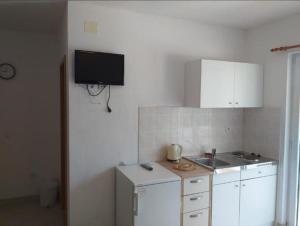 Kuchyň nebo kuchyňský kout v ubytování Studio apartmani Ante
