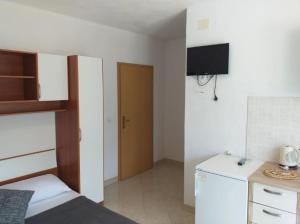 Kuchyň nebo kuchyňský kout v ubytování Studio apartmani Ante