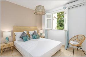 Postel nebo postele na pokoji v ubytování Villa Mango 150 mètres plage à pied