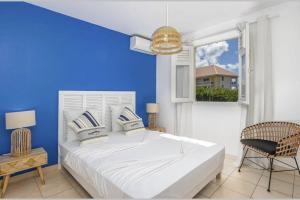 Postel nebo postele na pokoji v ubytování Villa Mango 150 mètres plage à pied