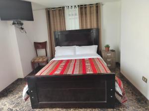 Hostal Killaly Inn Cusco客房内的一张或多张床位