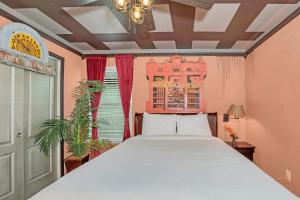 a bedroom with a large bed and a window at 5532 Misty Oak Circle in Davenport +58 photos