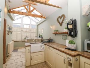 a kitchen with a sink and a window at The Nutshell in Chester-le-Street