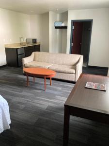 a living room with a couch and a coffee table at Elker Inn & Suites in Ridgway