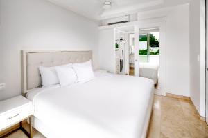 מיטה או מיטות בחדר ב-Antera Hotel & Residences