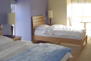 Krevet ili kreveti u jedinici u okviru objekta Pier Head Hotel Spa & Leisure