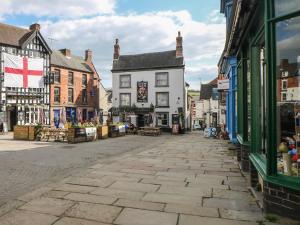 an empty street in a town with buildings at Kennedy's Cottage in Ashbourne