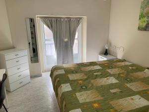 Posteľ alebo postele v izbe v ubytovaní Apartamento en Cádiz capital