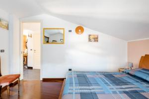 a bedroom with a bed and a mirror on the wall at Oleandro Room in San Severino Lucano