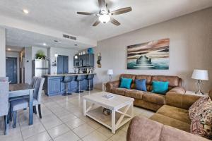 a living room with a couch and a table at Sonoran Sea 310-W - Modern 1 bedroom in Puerto Peñasco