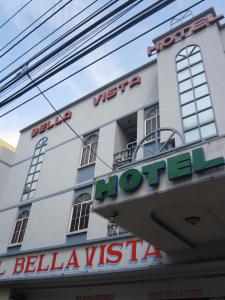 a building with a sign on the front of it at Hotel Bella Vista in Panama City