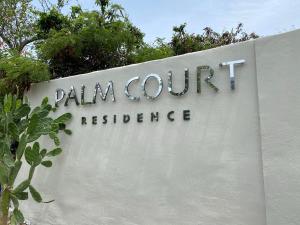 a sign for a palma court residence at 28 - Jordan Village beautiful studio - Résidence Palm Court in Cul de Sac