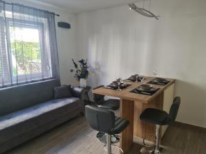 a living room with a table and a couch at Apartman Nika in Crikvenica +17 photos