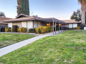 a house with a sidewalk in front of a yard at Private, Spacious, 4x Queen, 300 MBPS Internet with Backyard! in Hemet