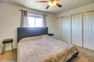 a bedroom with a bed and a ceiling fan at Cozy Colorado Retreat with Patio, Grill and Fire Pit! in Alamosa