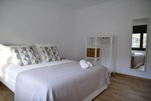 Posteľ alebo postele v izbe v ubytovaní Can Mosqueroles casa en Castellfollit de la Roca