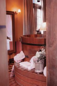 a hotel room with a circular stairway with a pot of flowers at Hotel Boutique Quinta das Videiras in Florianópolis