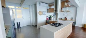 a kitchen with a white counter top and a stove at COBAR0108 - Edifício Oceania in Salvador