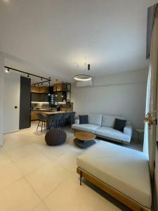 a living room with a couch and a table at Casa De Afrodite in Argostoli