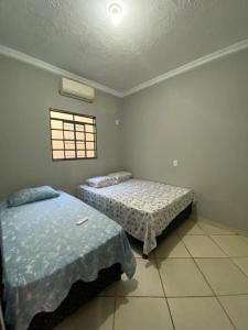A bed or beds in a room at Pousada São José