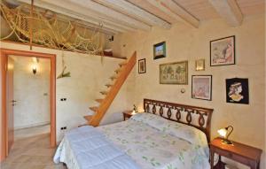 a bedroom with a bed and a staircase at Casa Montesole in Licata
