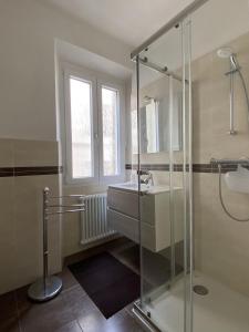 a bathroom with a glass shower and a sink at Casa Dilma in Lenno +34 photos