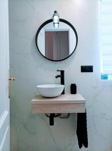 a bathroom with a sink and a mirror at O balcón do Río in Caldas de Reis