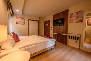 Postel nebo postele na pokoji v ubytování Hotel Schwarzbachtal Hideaway