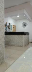 a man standing at a counter in a kitchen at Pansion Milena i Mario in Međugorje