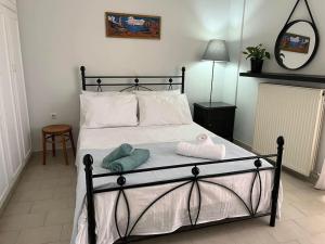 Кровать или кровати в номере Mονοκατοικία - Mεζονέτα