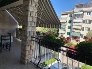 a balcony with a view of a building at Apartment Chie in Izola +2 photos