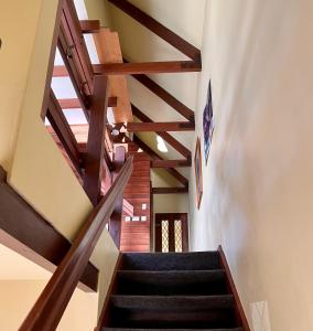 a staircase in a house with wooden ceilings at Clearview - Lake Tekapo in Lake Tekapo