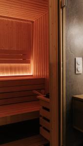 a sauna with wood paneled walls and a wooden floor at Okno Na Ślężę in Sady +19 photos